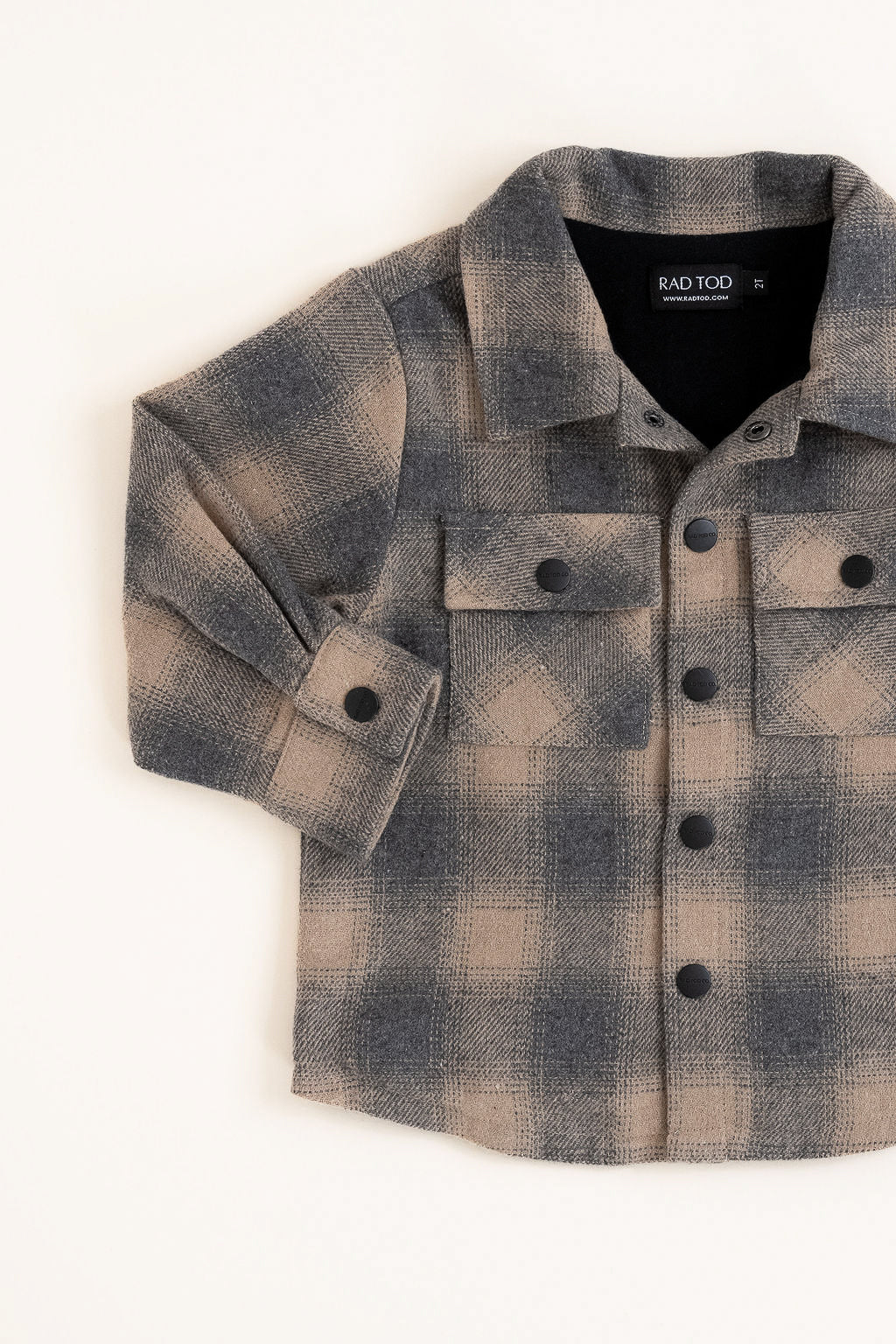 Flat lay of the Sandstorm Toddler Shacket with soft cotton lining.