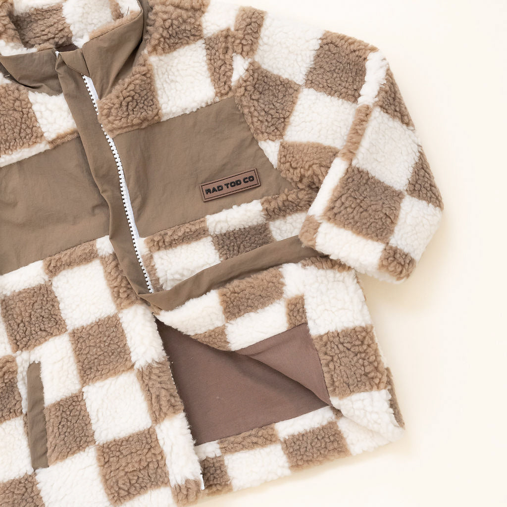 Teddy Checkerboard Sherpa jacket in beige checker pattern – zip-up design