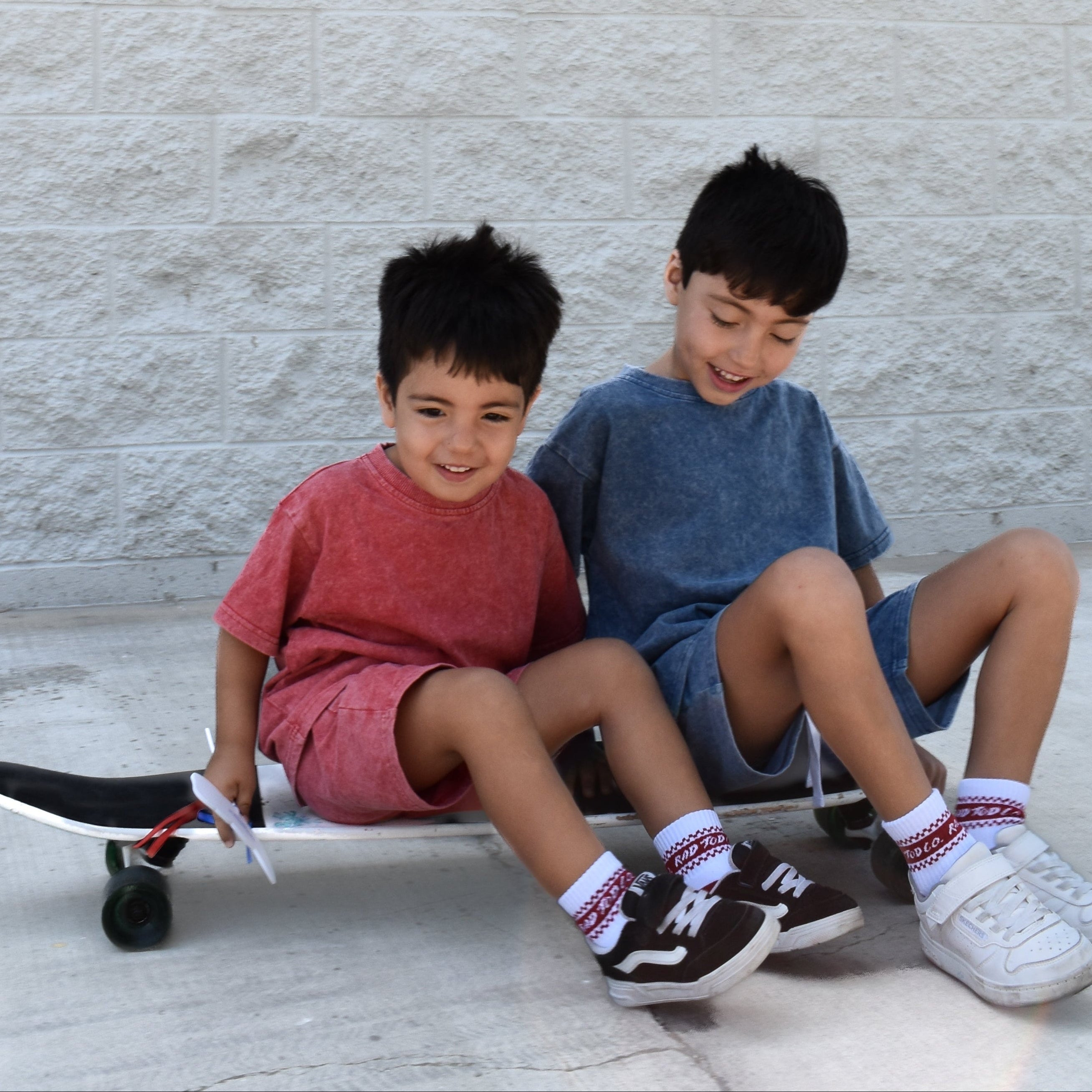 two boys wearing vintage red and vintage blue sets by rad toddler