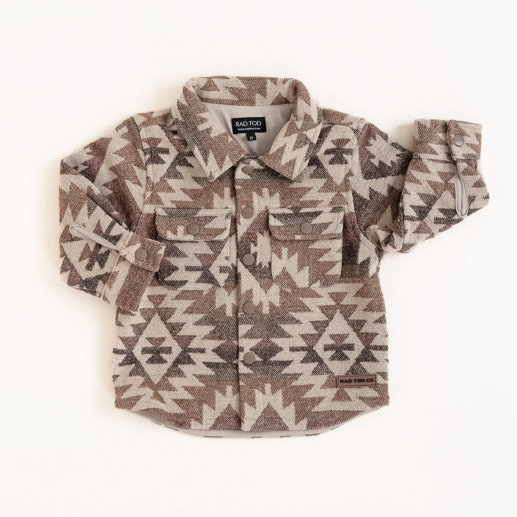 Flat lay of the Zion Jacket with earthy patterned design and soft lining