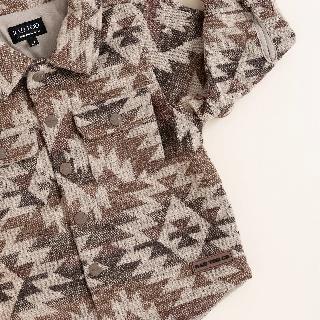 Flannel shirt with geometric pattern on a white background