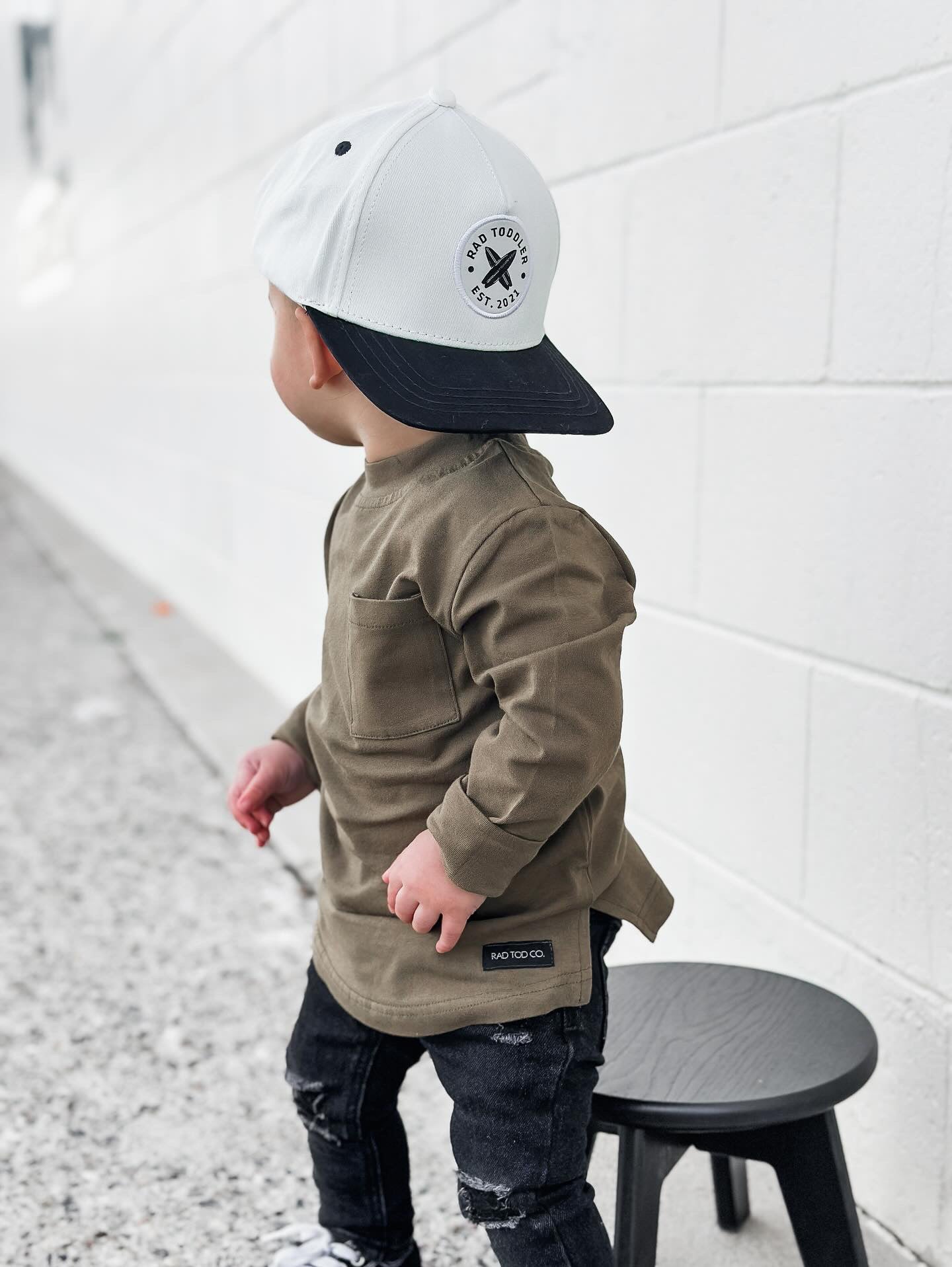 Toddler Hat design in daybreak pattern wore by a toddler with brown shirt and black pajamas