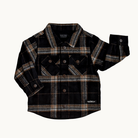 A black long-sleeve plaid button-up shirt by Bad God, featuring brown and beige stripes, laid flat on a light off-white background.