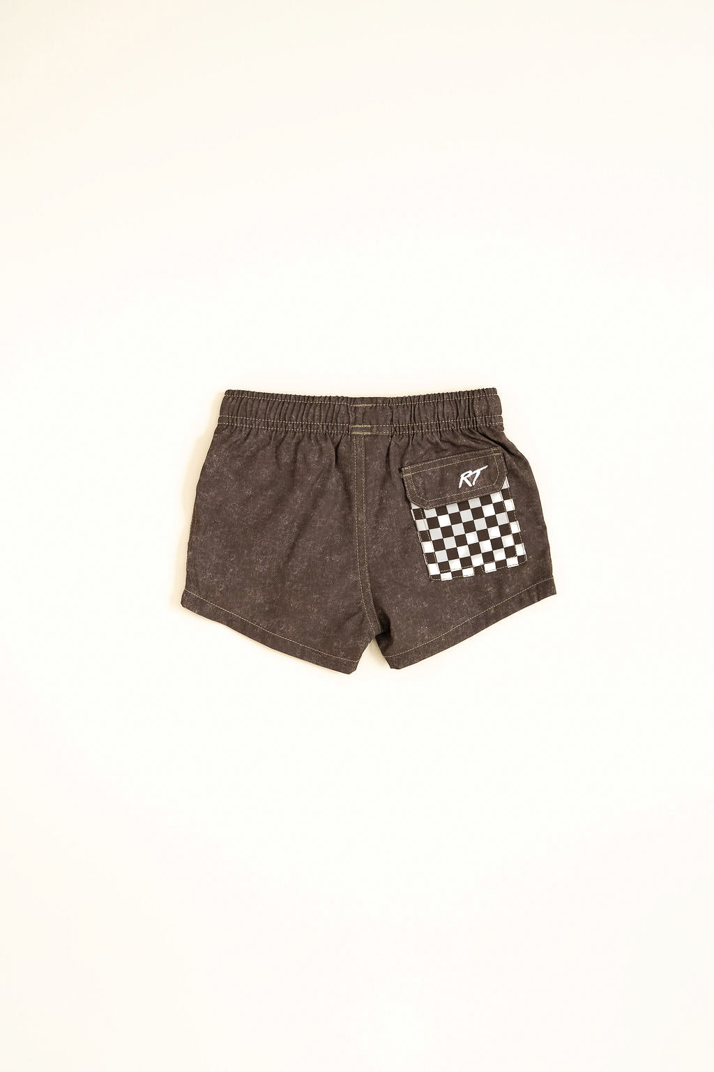 Brown shorts with a checkered pocket on a white background