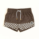 Brown shorts with a checkered pattern and a logo on a white background