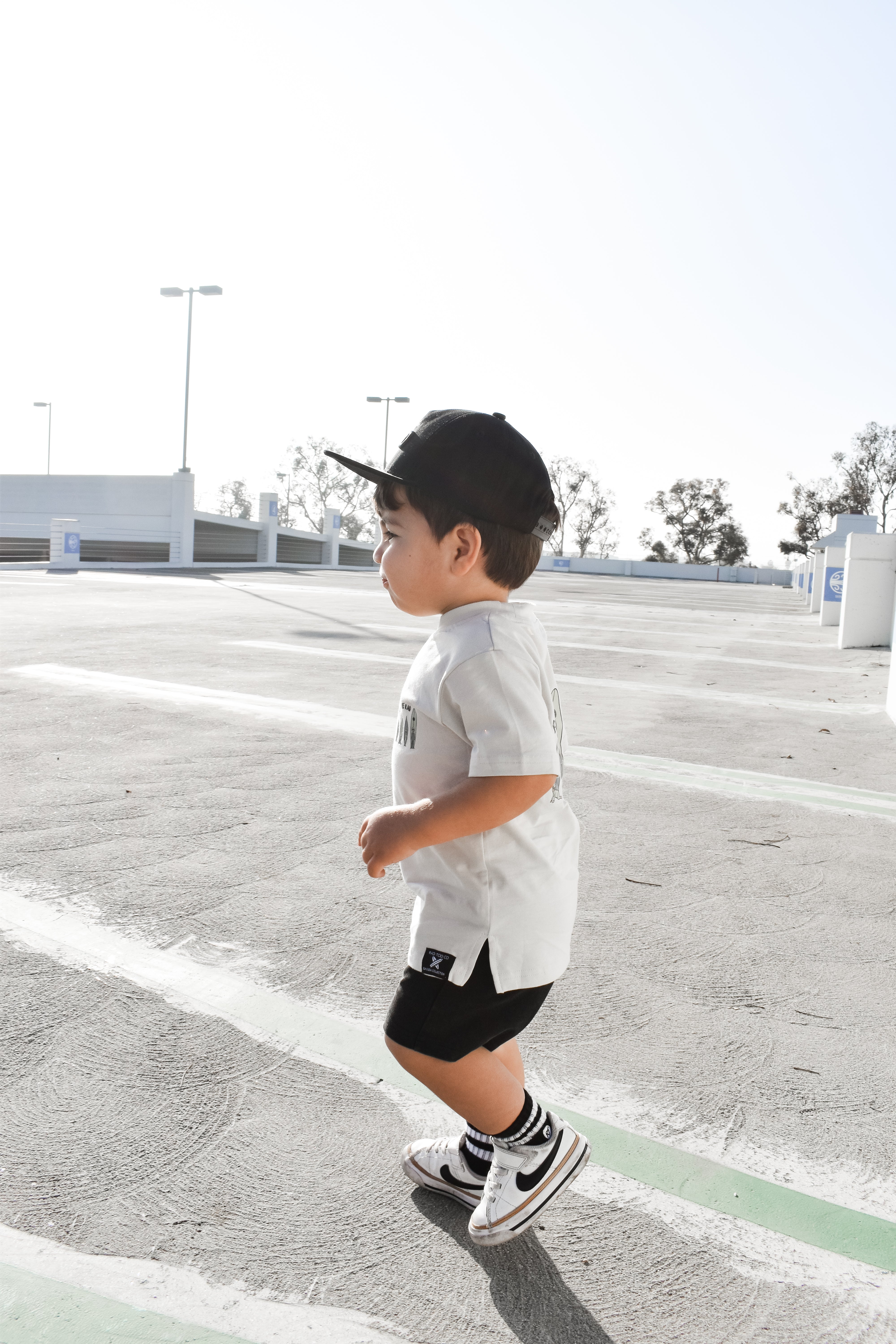 cool little dude wearing a Trendy toddler t-shirt with vibrant designs for comfortable everyday wear