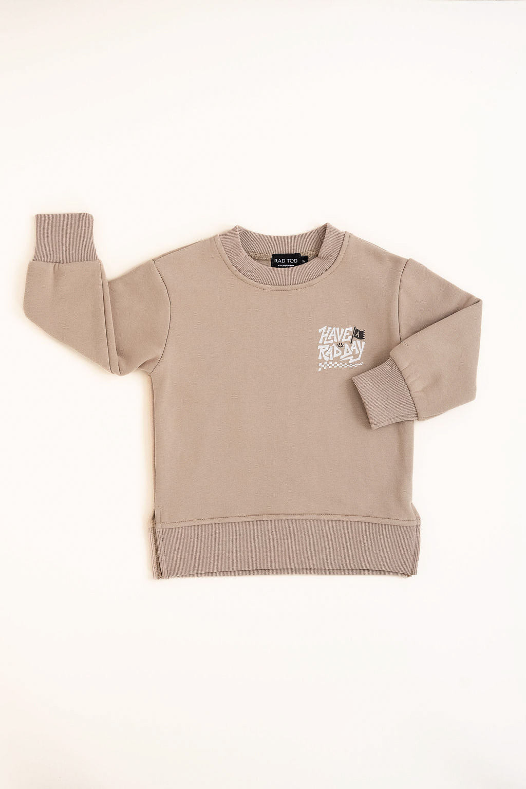Kids beige graphic crewneck with playful white lettering and checkered design displayed on white background