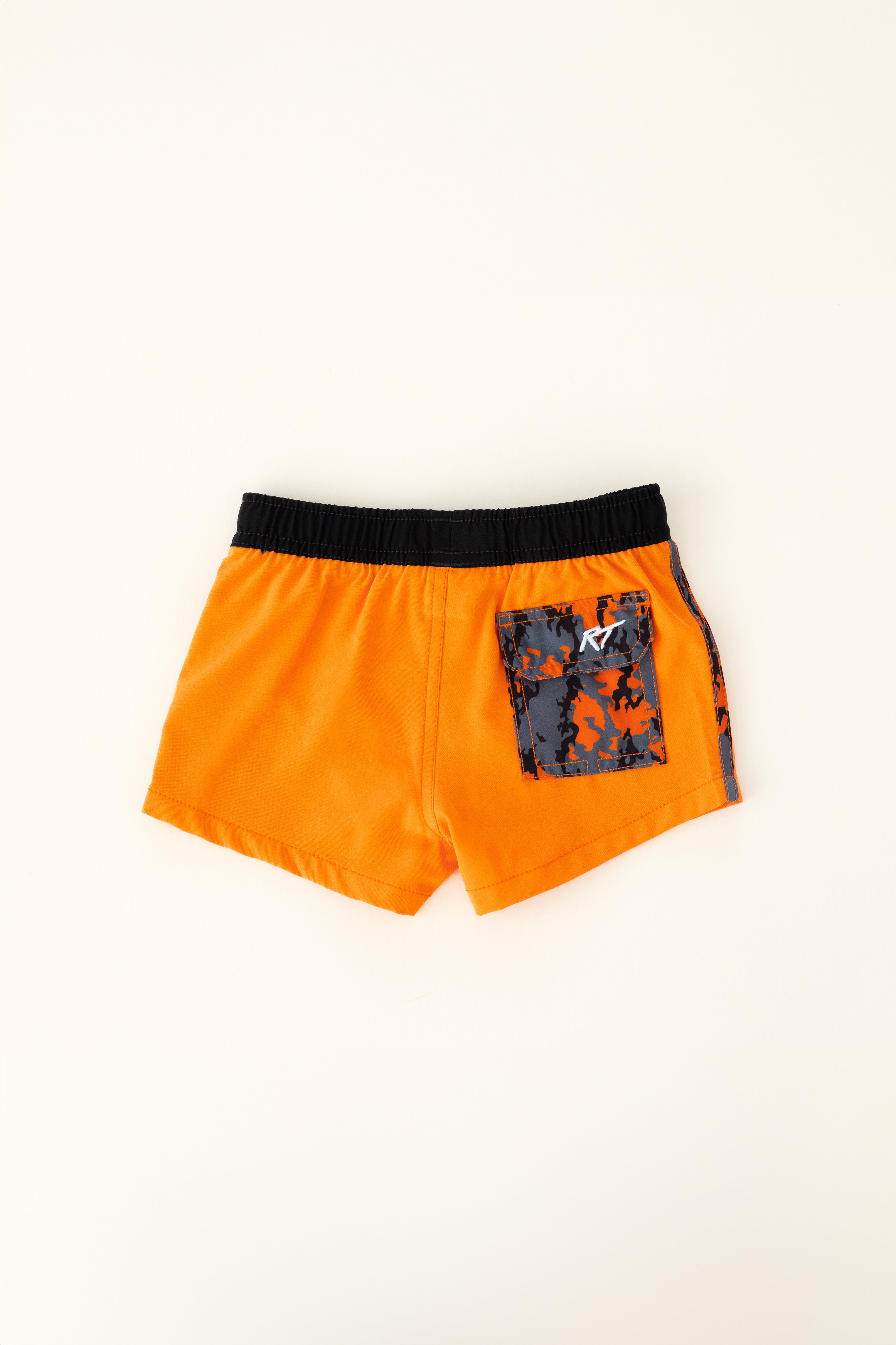 backside of Bright orange swim shorts with an elastic waistband and drawstring, made from quick-drying fabric. Ideal for swimming, beach trips, and outdoor activities. Features vibrant patterns and a comfortable fit for active kids.