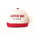 White and red cap with 'LOVER BOY est. at birth' text on a white background