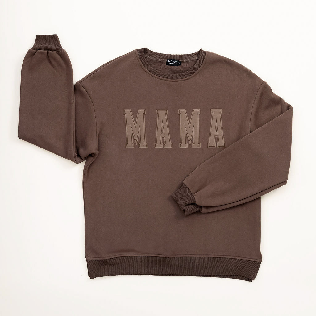 Brown sweatshirt with 'MAMA' text on a white background