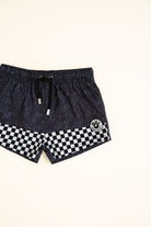 Black shorts with a checkered pattern on a white background by Rad Toddler