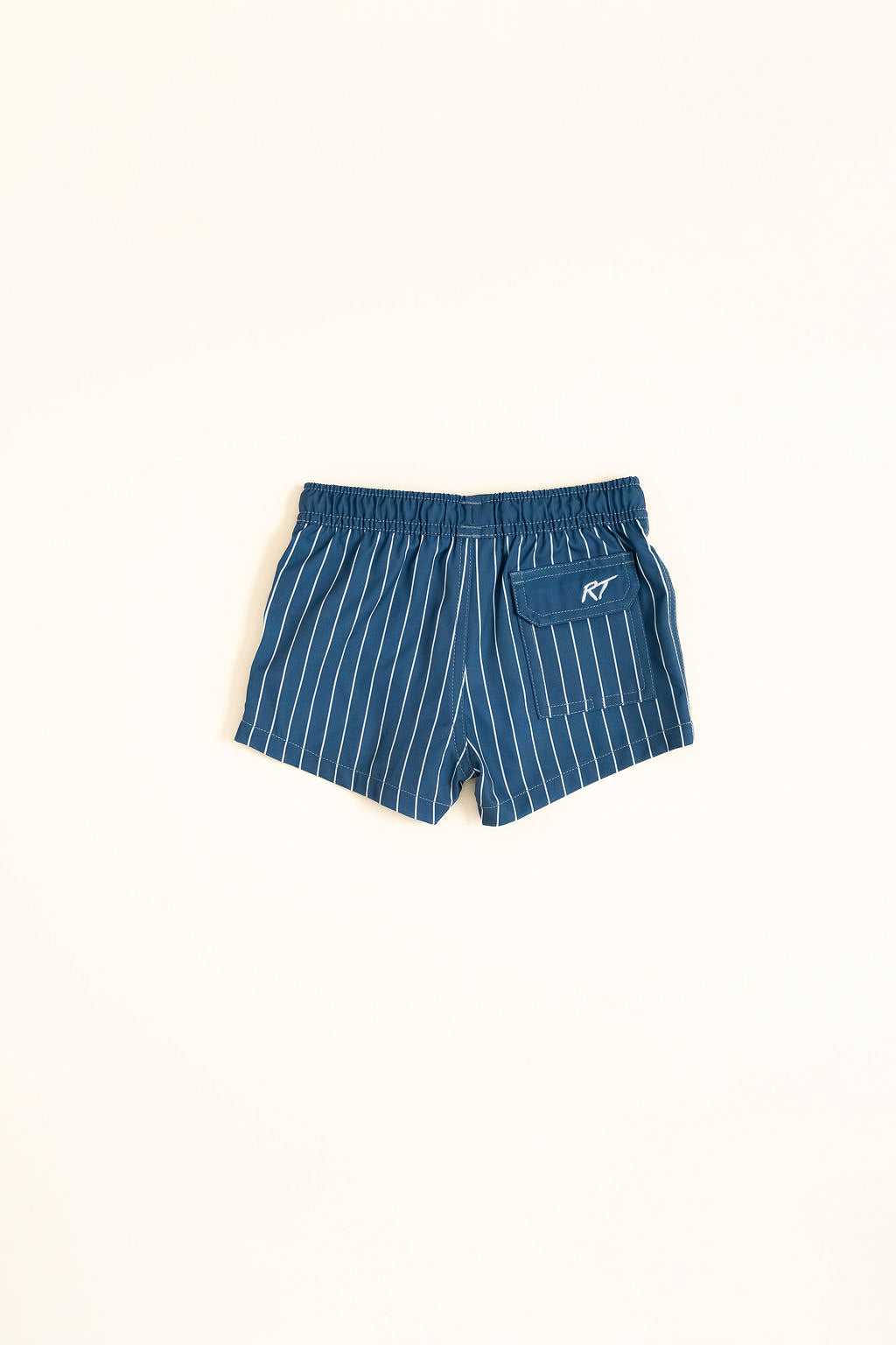Blue pinstripe shorts with a logo on a white background by rad toddler