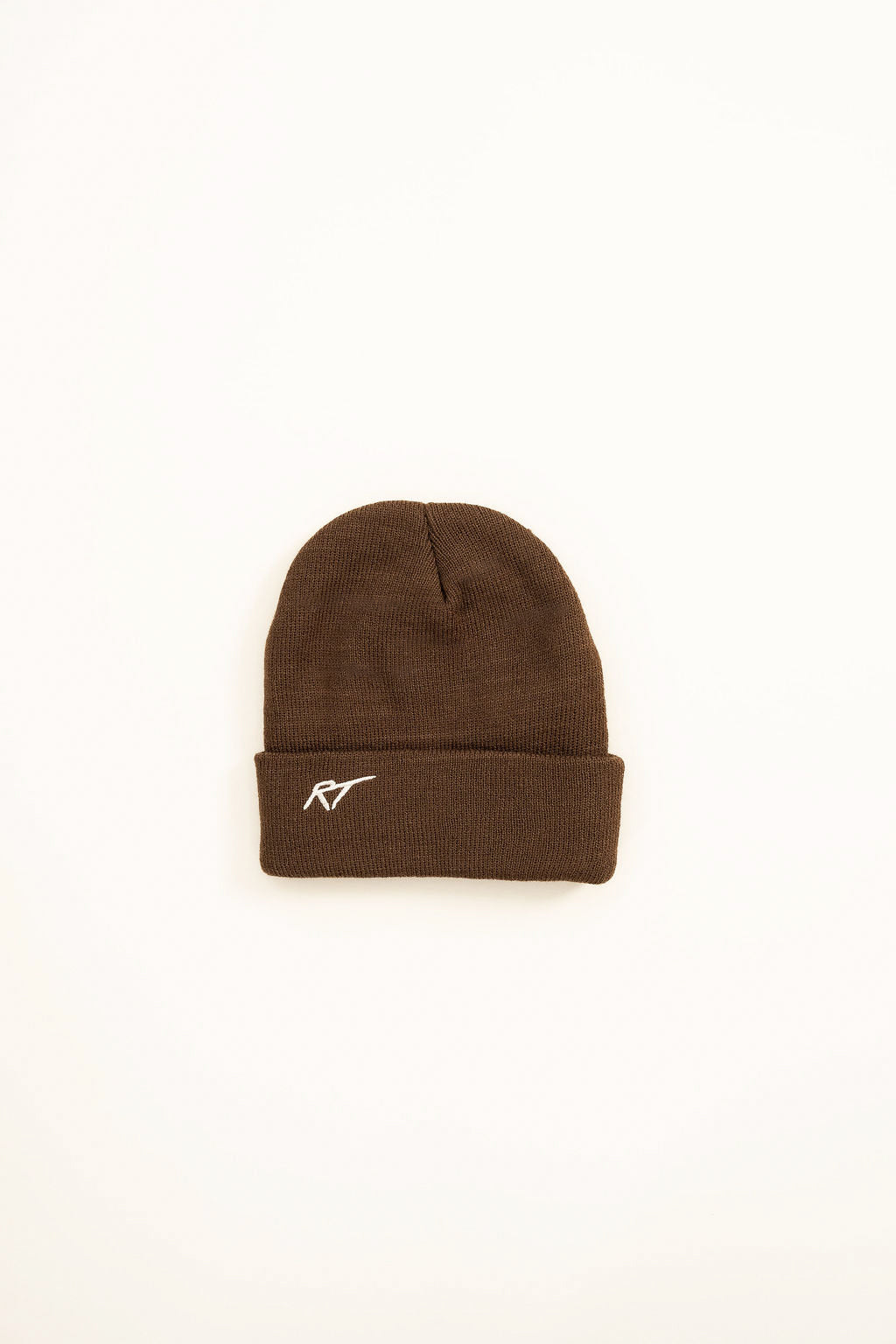 Flat lay of Chaos Club toddler beanie in brown knit, RT logo on back