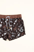 Brown swim shorts with palm tree and 'Salty Bro' print on a white background
