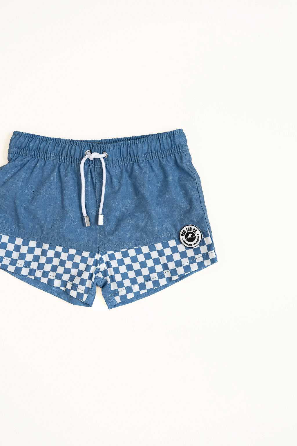 Blue shorts with a checkered pattern on a white background by rad toddler