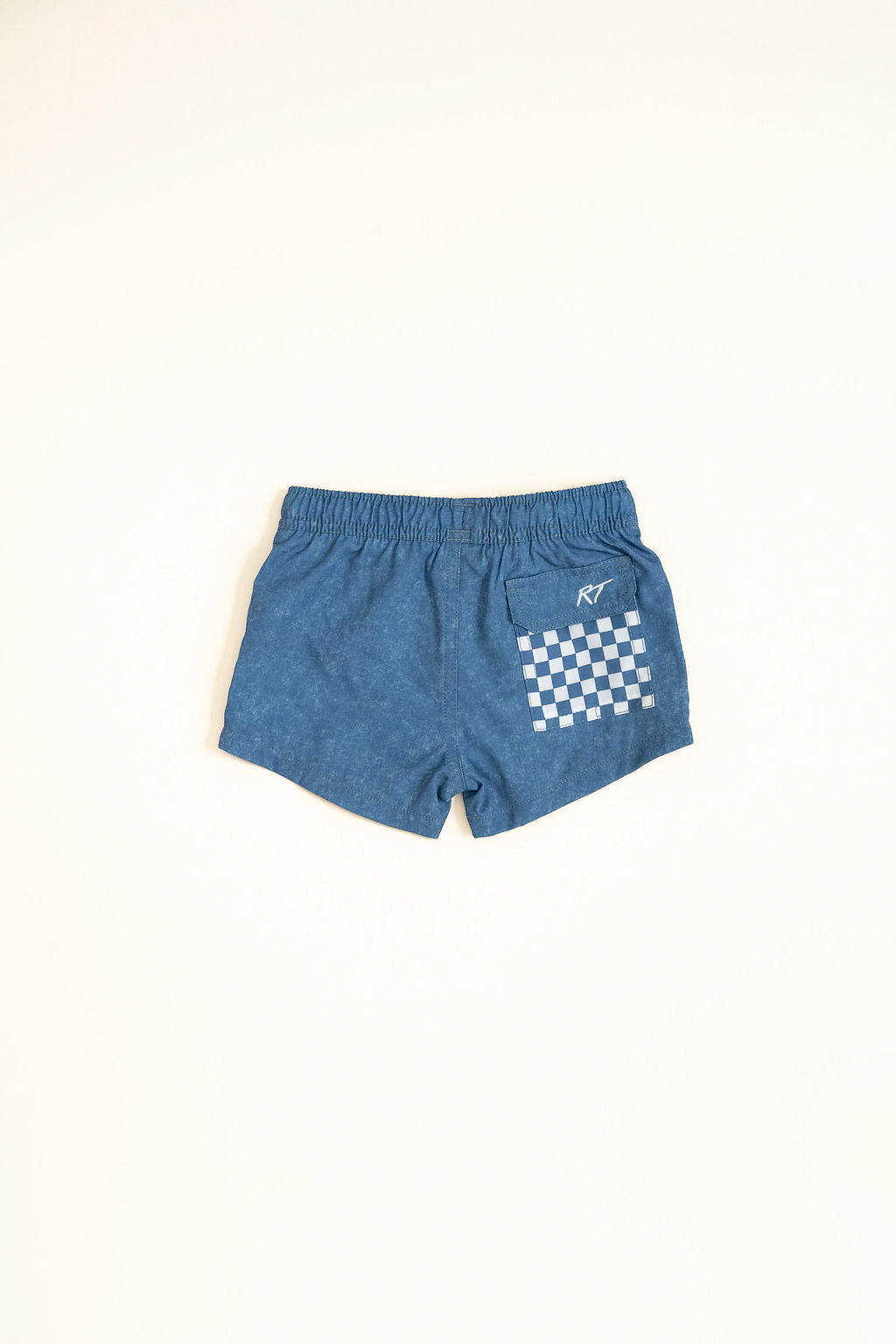 Blue shorts with a white checkered pattern on a white background backside by rad toddler