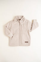 Beige children's jacket on a white background