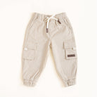 Beige cargo pants on a white background