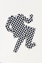 Black checkered 2-piece pajamas for toddlers and kids, featuring a comfy fit and elastic waistband by Rad Toddler.