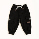 Black cargo pants with white drawstring on a white background