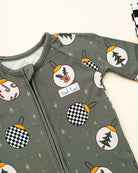 Pine green kids holiday pajamas with festive ornament design close up