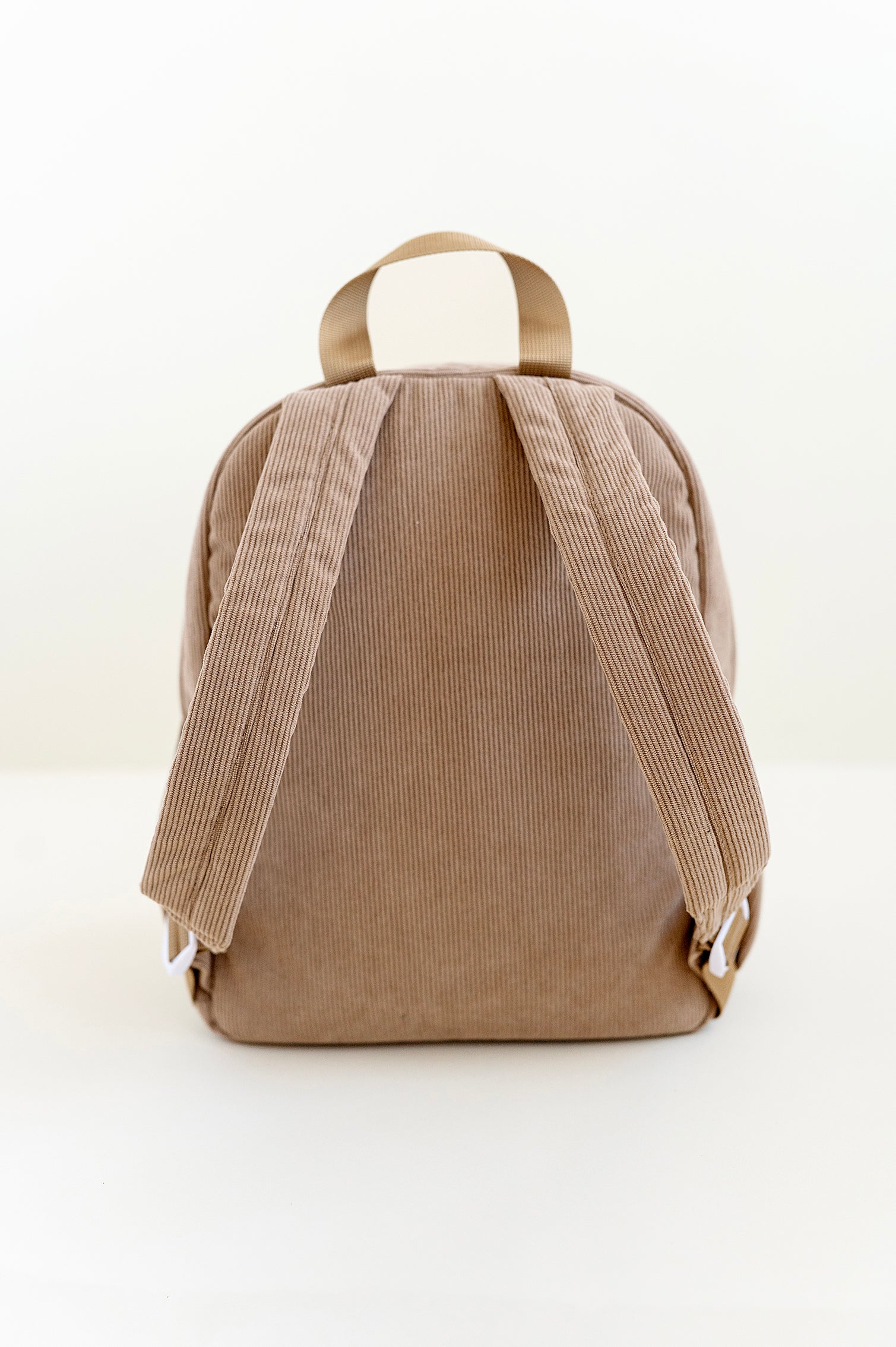 back side of a dune toddler backpack