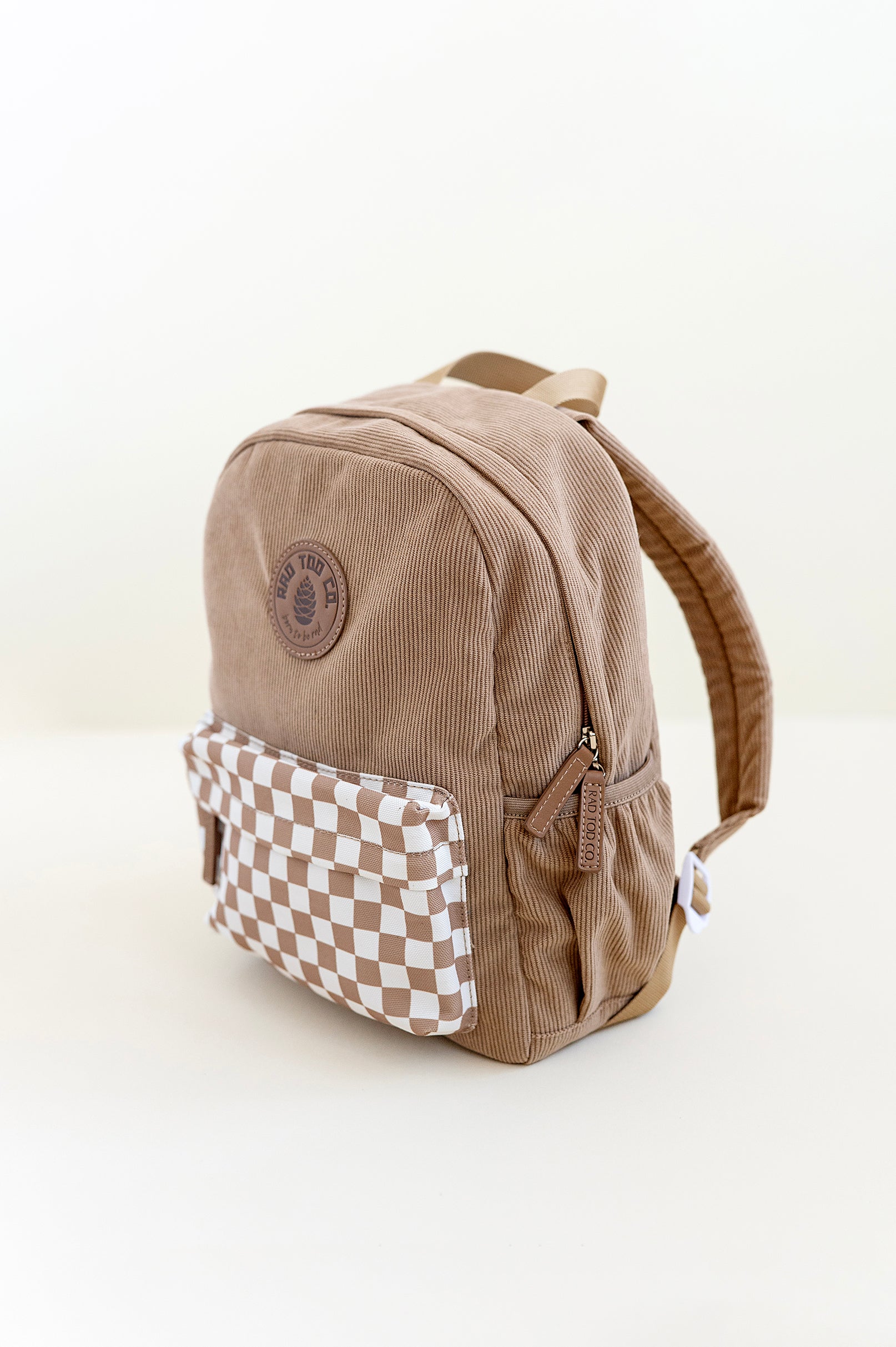 Beige toddler backpack with a stylish checkerboard pattern, perfect for everyday adventures and activities side view