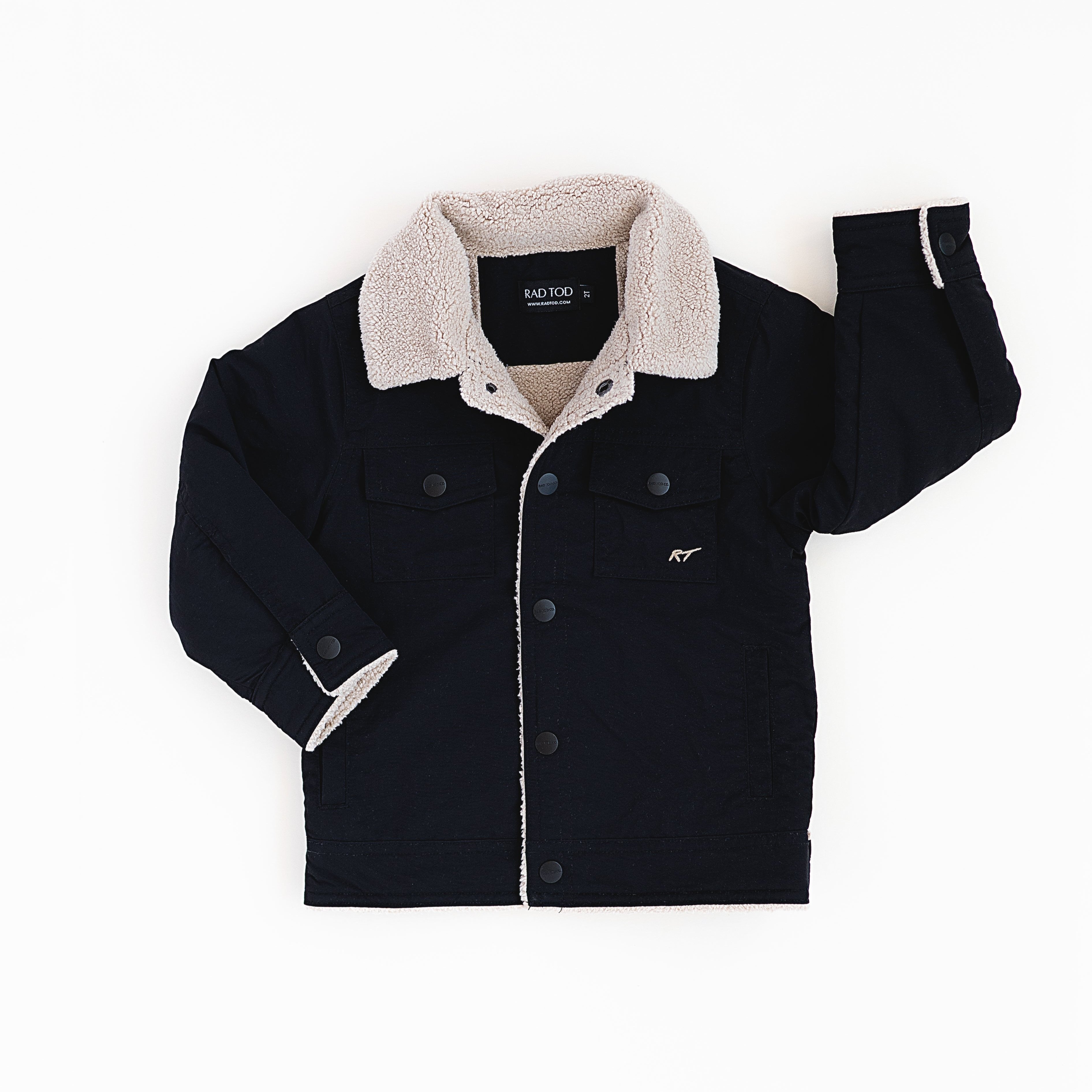 "RAD TODDLER medium-weight water-resistant jacket with sherpa lining and collar, featuring subtle chest pocket embroidery in black