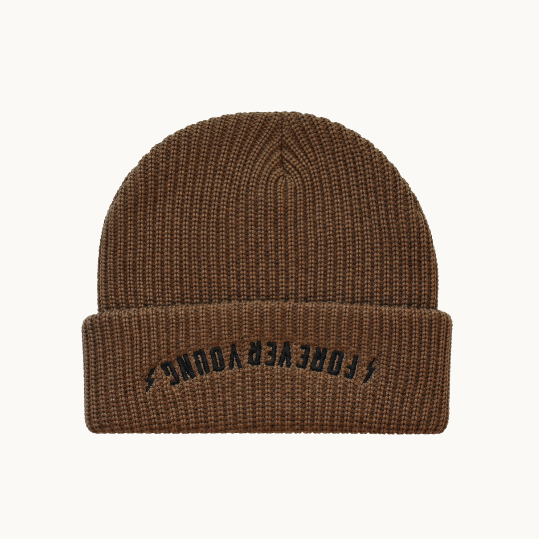 A brown ribbed knit beanie hat with a folded cuff, featuring the text 'FOREVER YOUNG' embroidered in black on the front cuff, set against a plain off-white background.