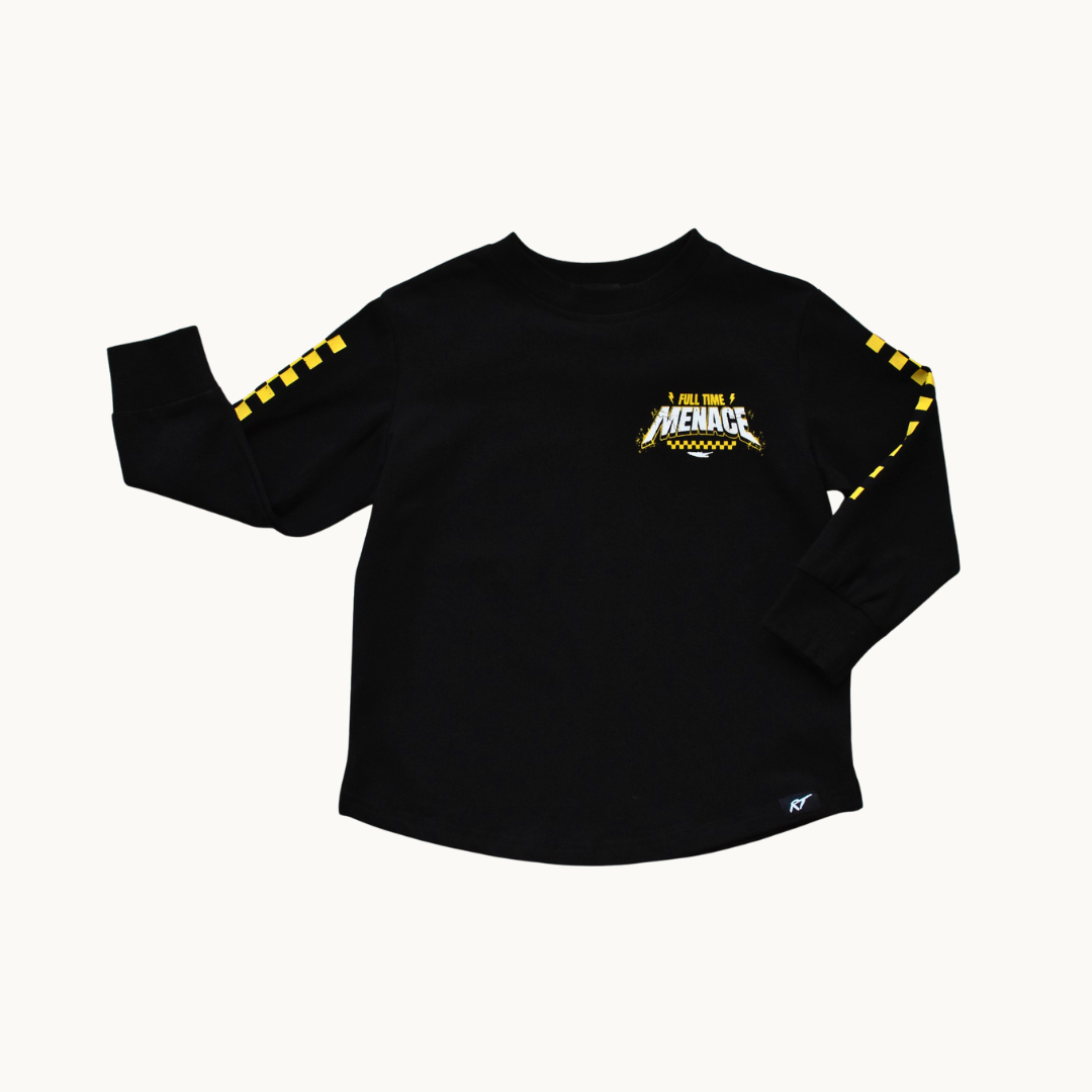 A black long-sleeve t-shirt with a yellow and white 'Full Time Menace' graphic on the left chest and yellow-and-black checkered stripes down both sleeves, displayed flat against a light off-white background.
