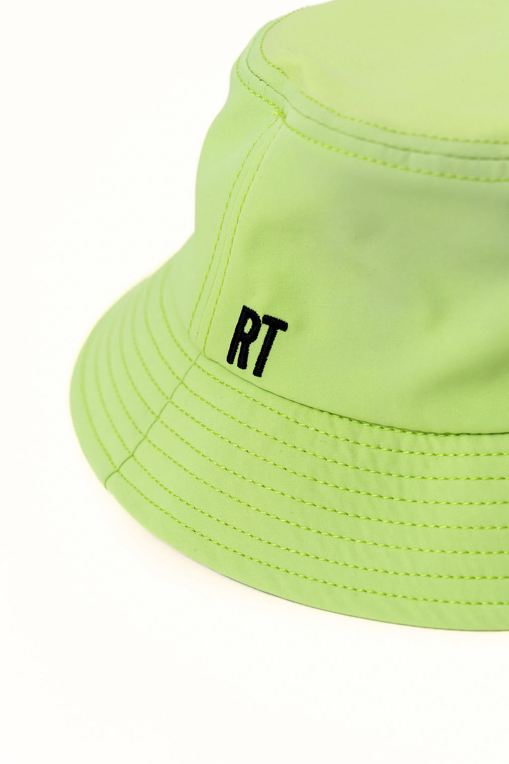 Neon green bucket hat with 'RT' logo on a white background