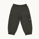 A pair of dark olive green cargo jogger pants with elastic waistband and ankle cuffs, featuring a small white lightning bolt patch on the right pocket, shown flat on a light off-white background.