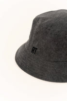 Dark gray bucket hat with a small logo on a white background