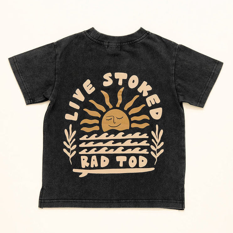 Black acid wash kids t-shirt with Live Stoked golden sun and surfboard graphic