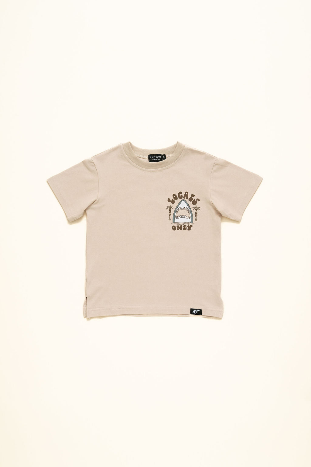 Beige “Locals Only” kids t-shirt with shark graphic, premium cotton blend front side