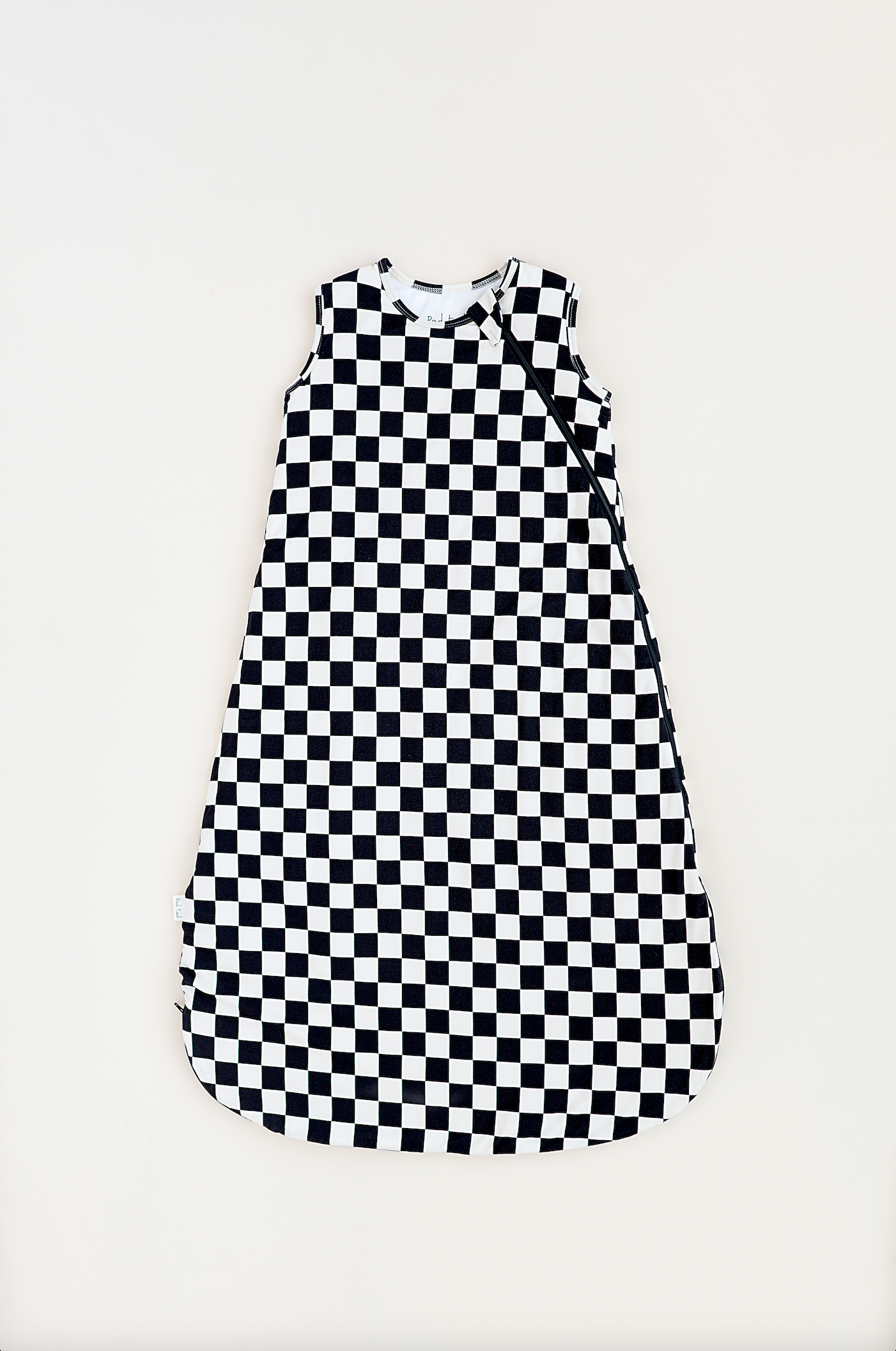 Bamboo sleep bag for toddlers in black and white checkered pattern, featuring a two-way zipper by Rad Toddler.
