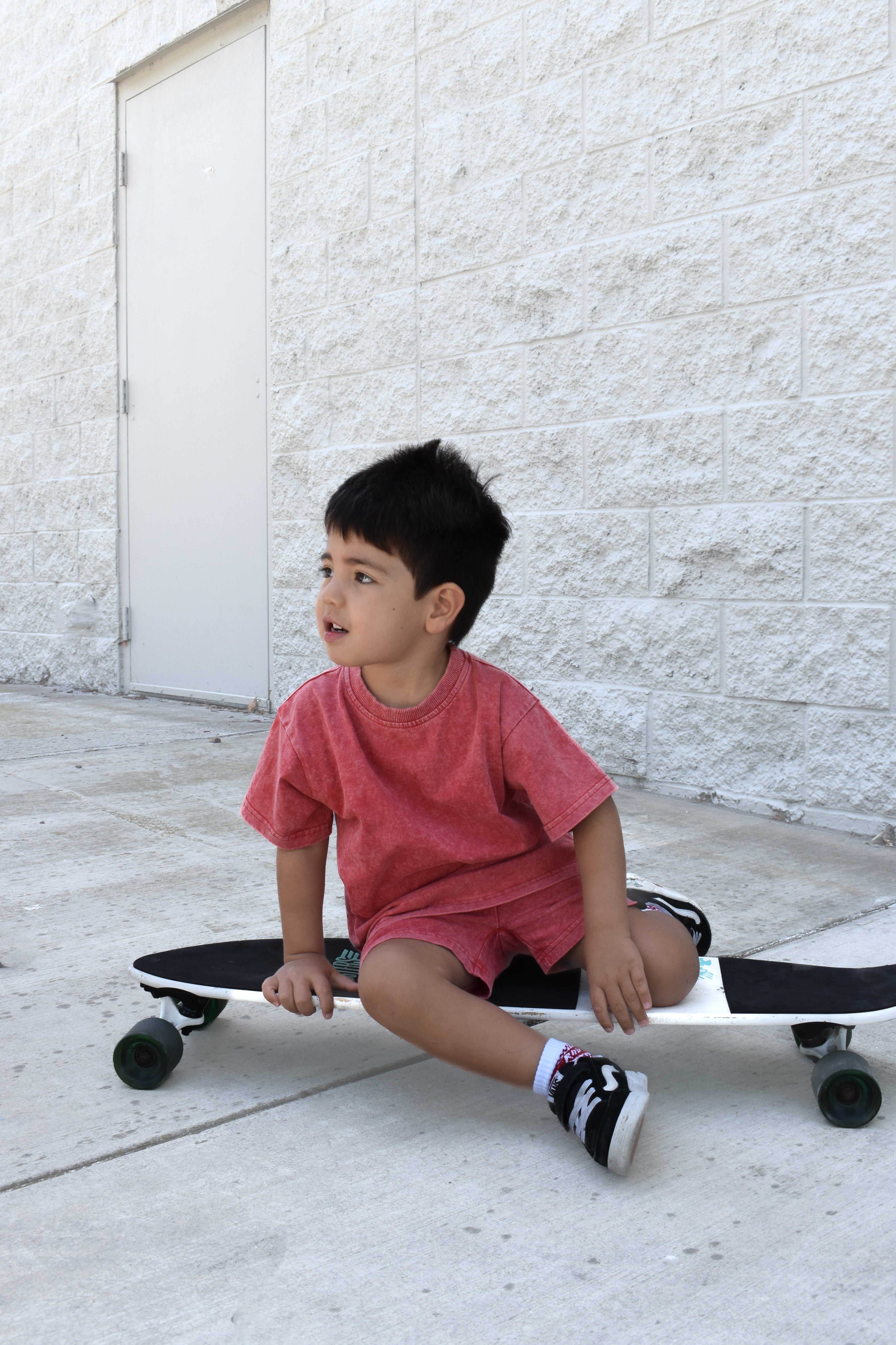 Kids muted red stone wash shorts and tee with vintage washed fabric, elastic waistband, and relaxed everyday fit for comfortable summer wear.