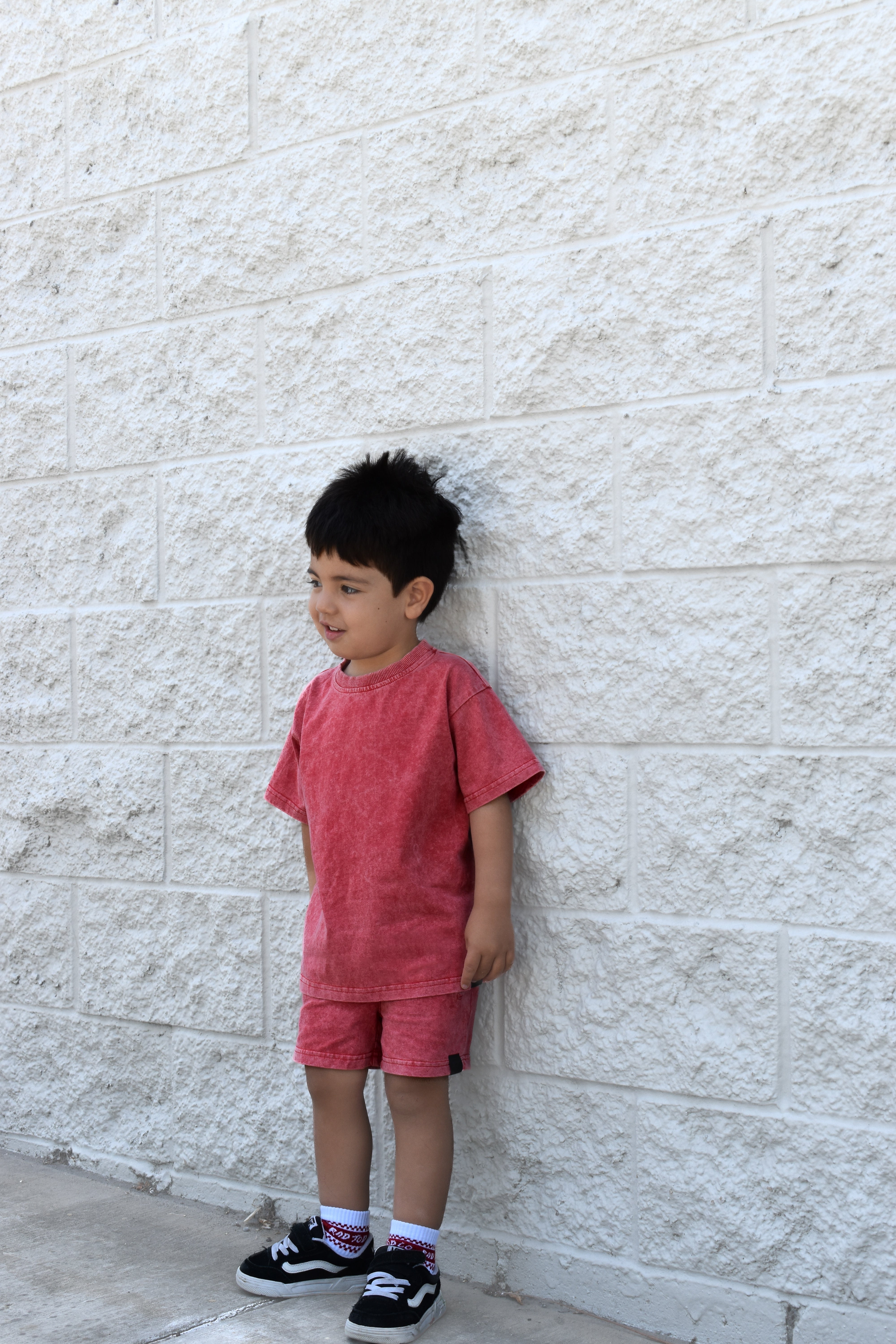 Kids muted red stone wash tee with vintage washed fabric, relaxed fit, and soft lightweight feel paired with matching stone wash shorts.
