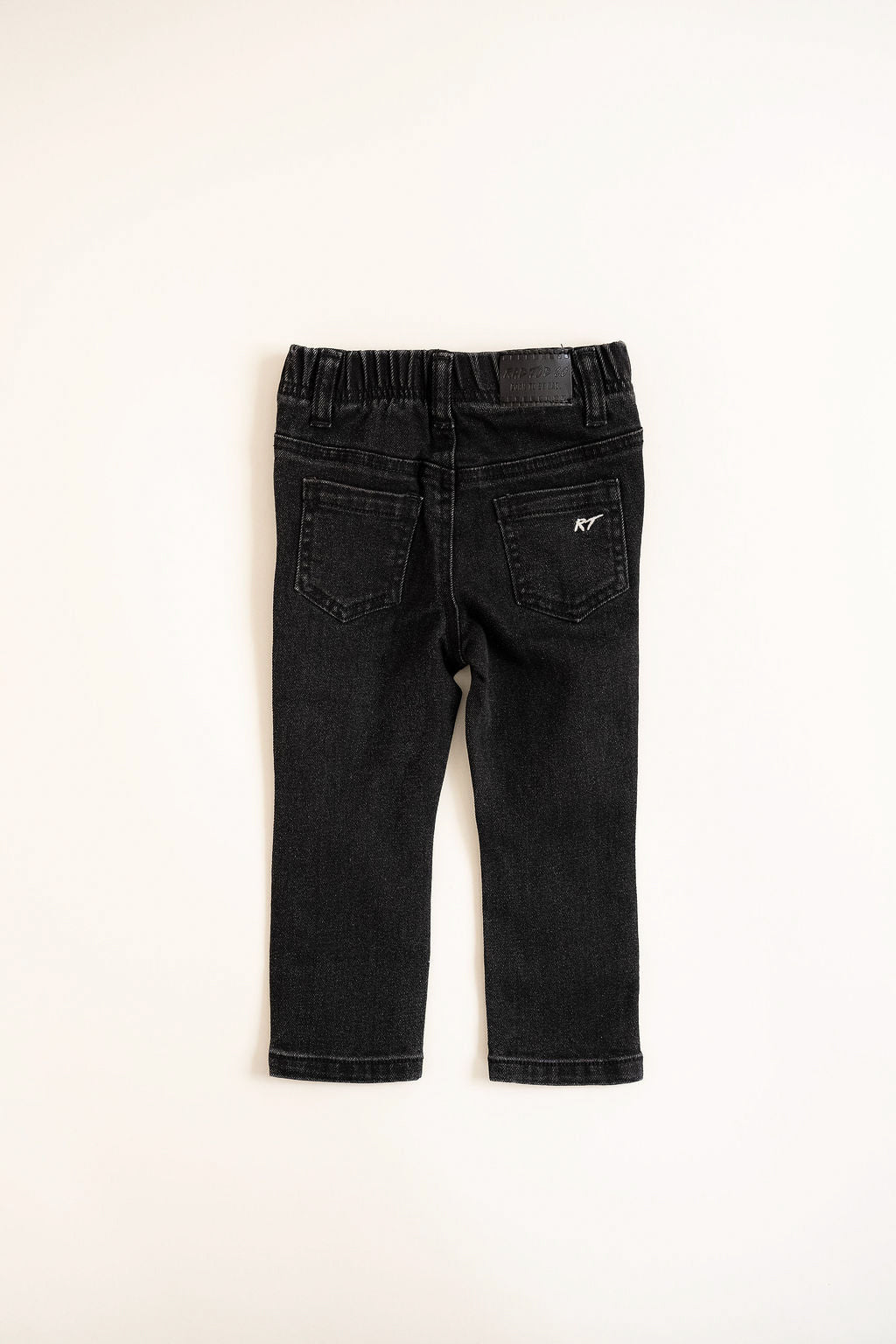 back of Black jeans on a white background