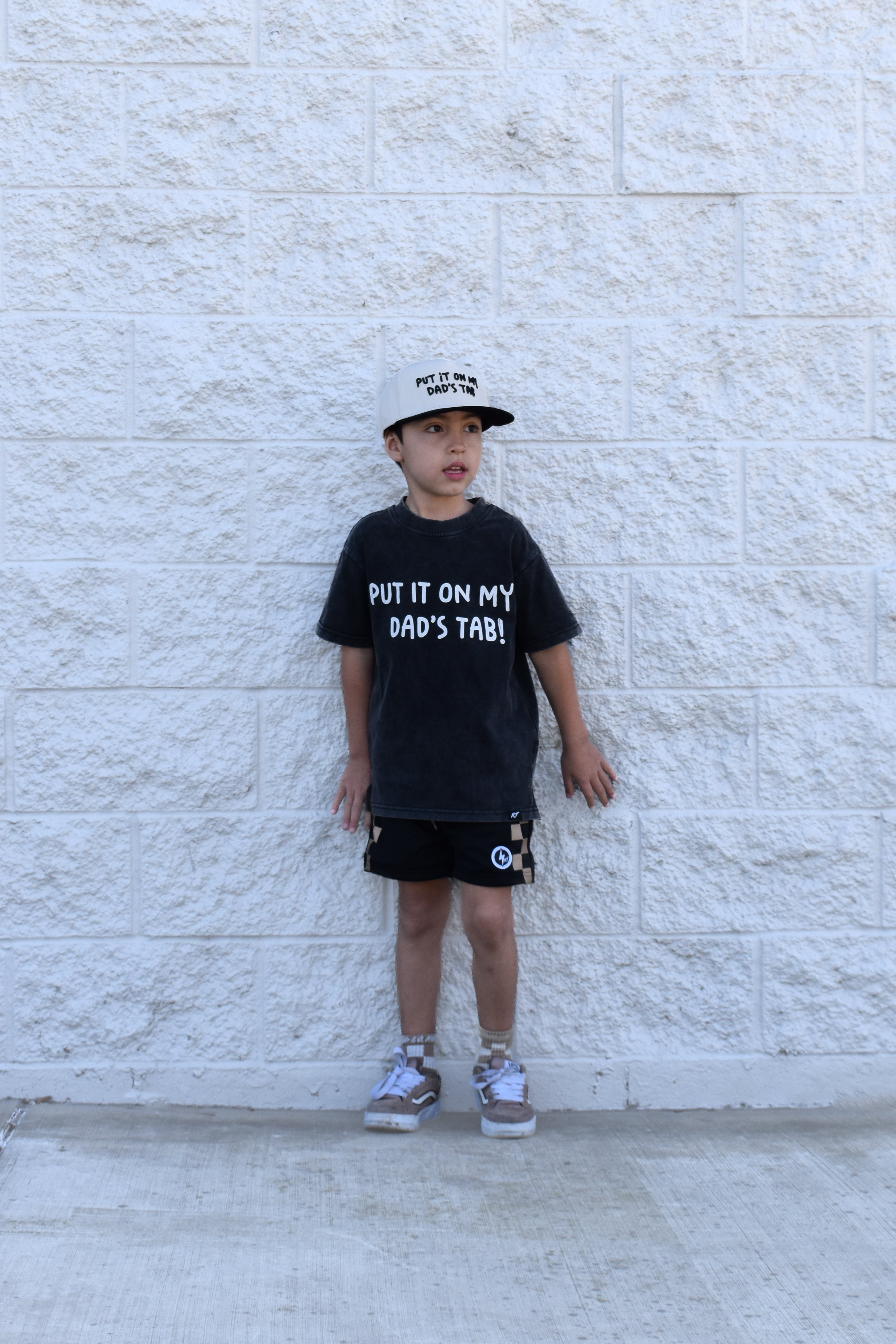 Trendy kids graphic tee Put It On My Dad’s Tab black acid wash