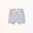 Flat lay of gray toddler shorts from the Core Collection with adjustable waistband and front pockets.