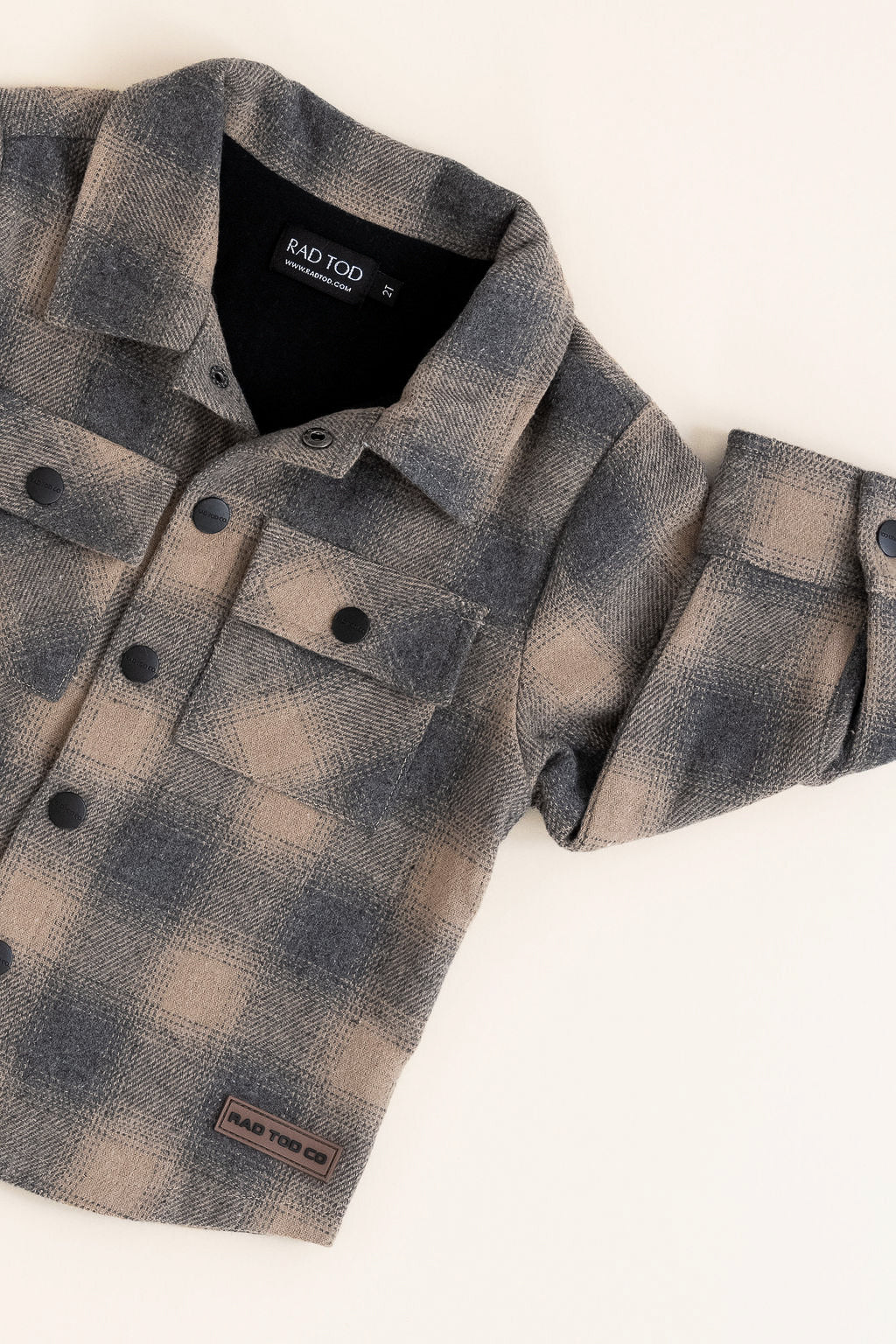 Plaid shirt with brand label on a white background