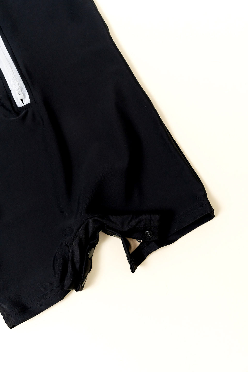 Close-up of snap button closure on kids rashguard