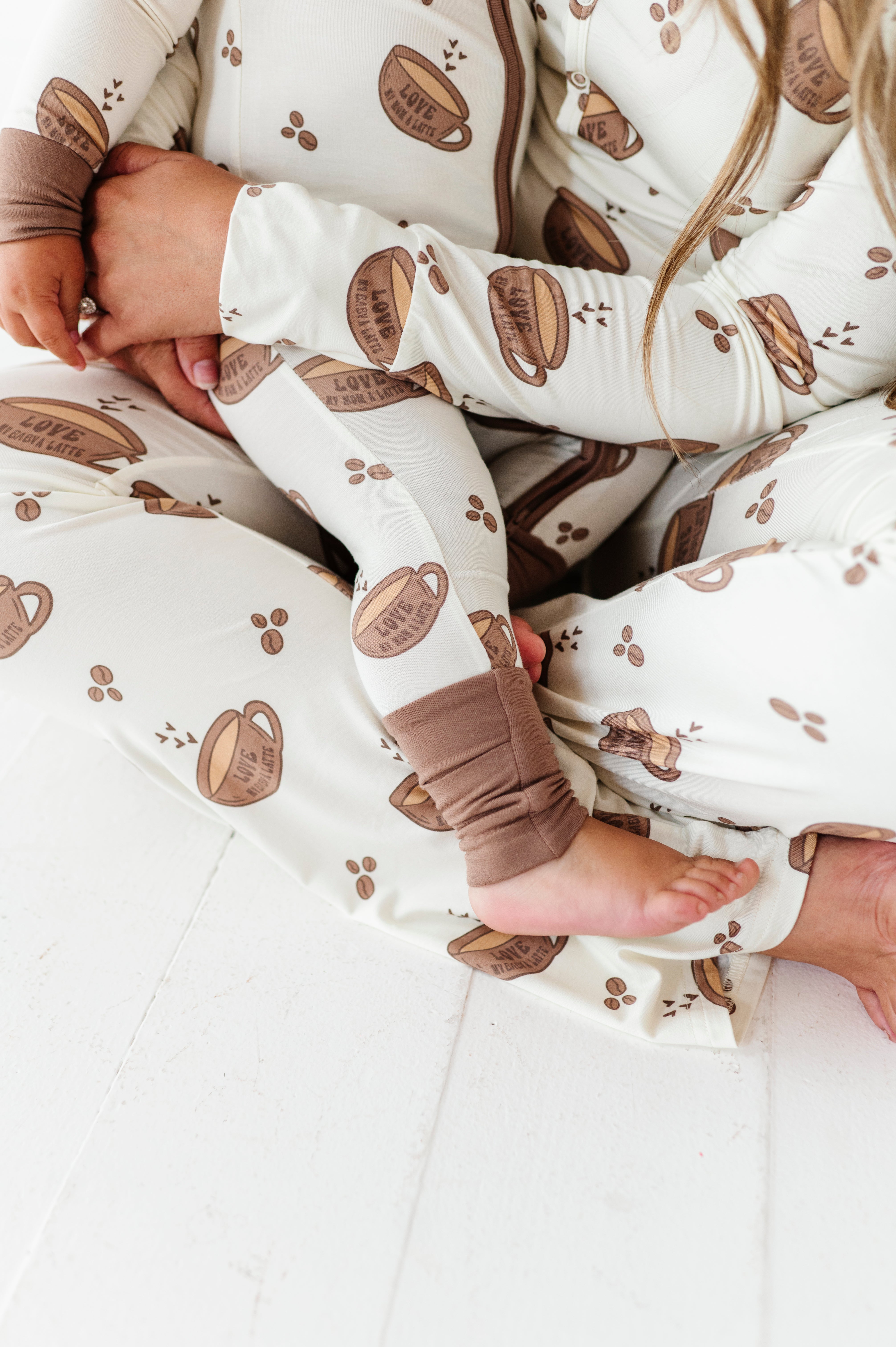 details in the matching love my baby a latte pajamas and love my mama a latte pajama sets