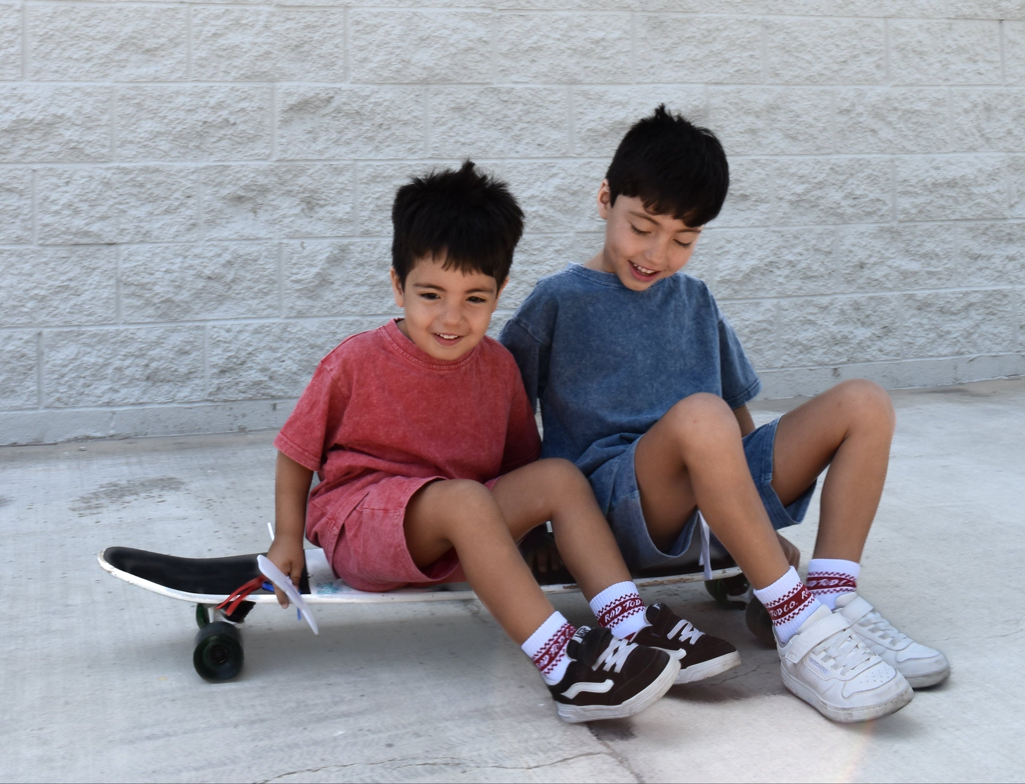 two boys wearing vintage red and vintage blue sets by rad toddler