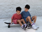two boys wearing vintage red and vintage blue sets by rad toddler