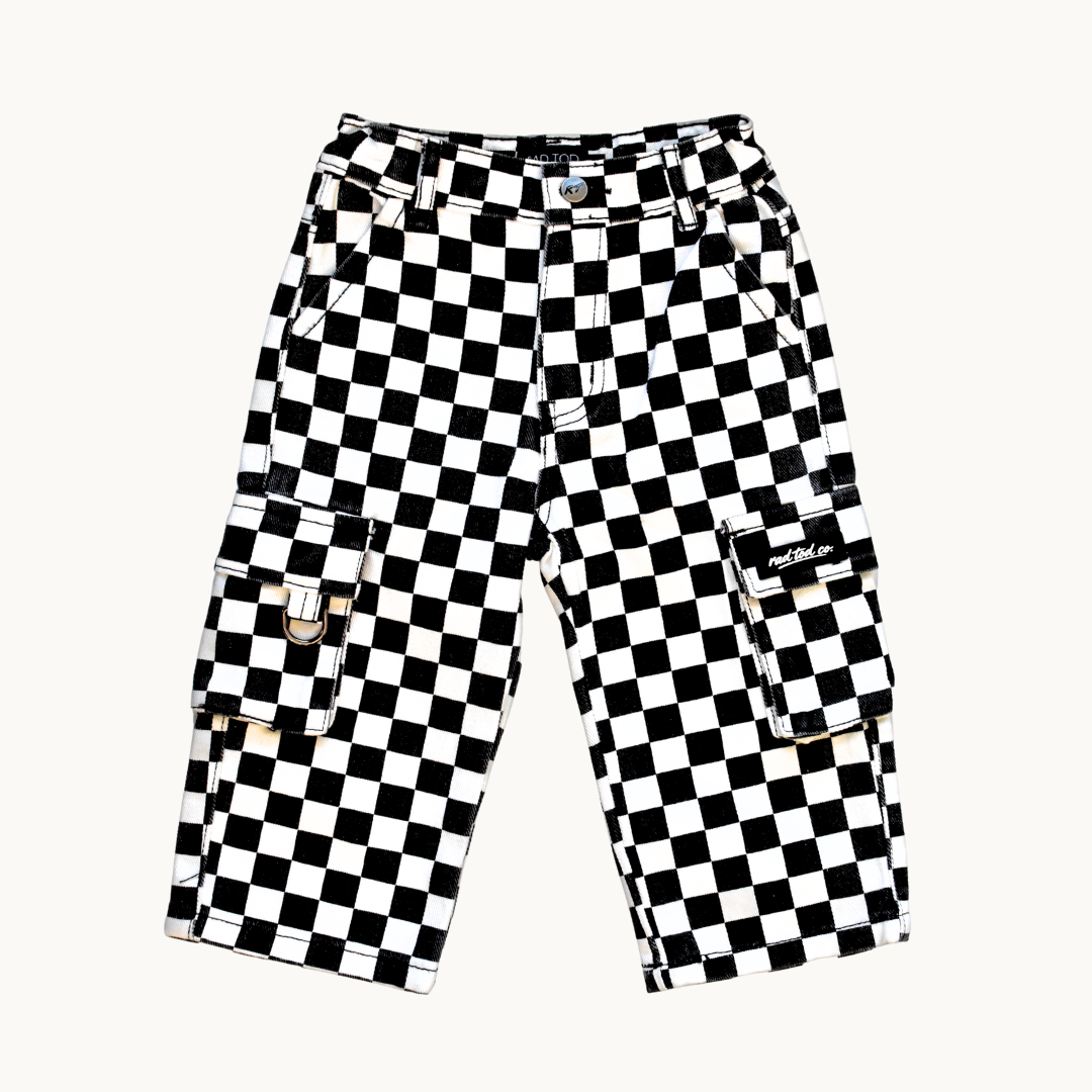 Black and white checkered cargo pants with multiple utility pockets, displayed flat against a light off-white background.