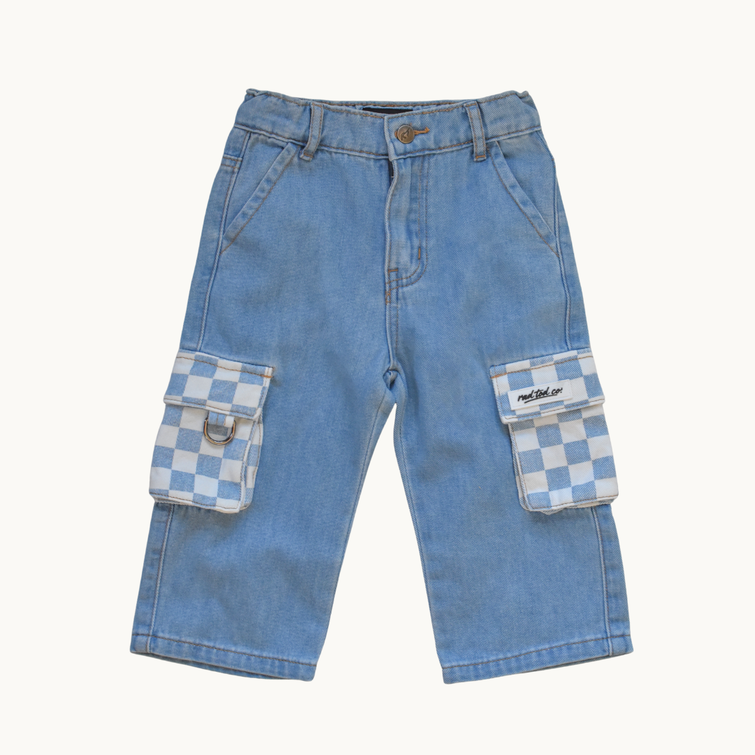 Light blue denim cargo pants with large flap pockets featuring a blue and white checkered pattern, shown flat on a light cream background.