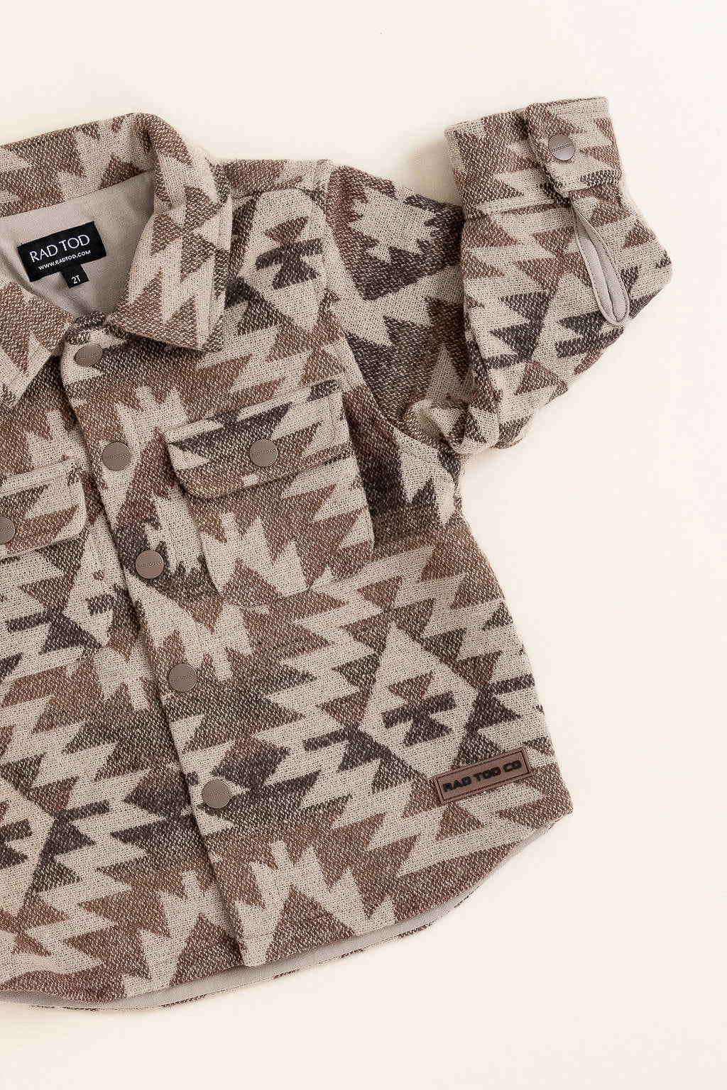 Flannel shirt with geometric pattern on a white background